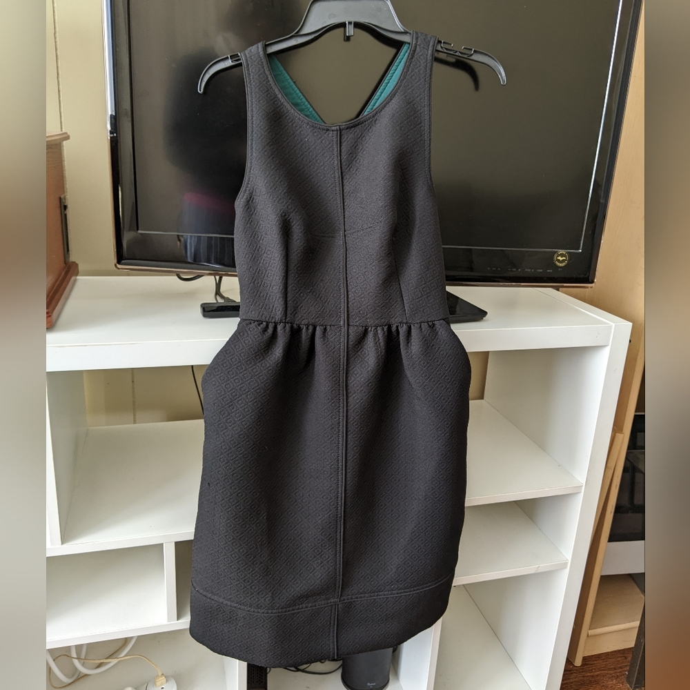 Tailored embossed black dress